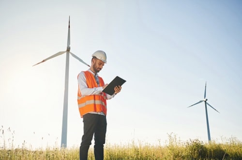 Man with wind turbine sustainability