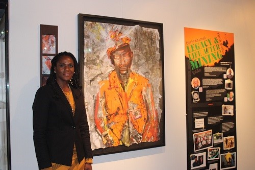 Norma Gregory, curator of the project with an image shown at one of the first exhibitions of the Black Miners Museum. Photograph: Norma Gregory